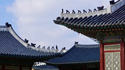 Closeup of a traditional Korean roof ridge design and ornamentation