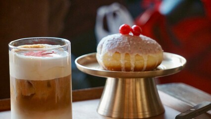 Gourmet coffee and doughnuts with cherries at a cafe in Seoul Korea