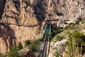 Caminito Del Rey Elevated Platform, King's Little Path Hanging Exit Boardwalk and Railway Line Bridge.  Dramatic Steep Gorge Cliff Walls El Chorro Spain Malaga Province
