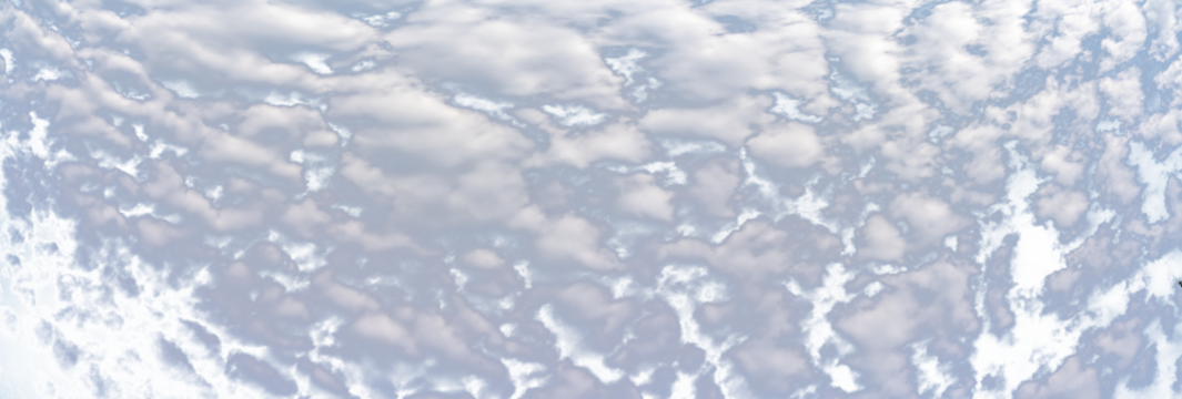 Panorama of puffy white summer clouds with a transparent sky
