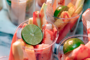 Glass with fruit, lemon and chili, a delicious and healthy snack