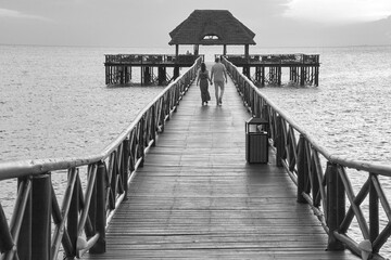 pier with walking couple