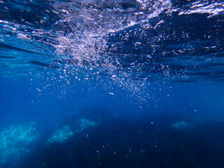 Air bubbles underwater rising to water surface, natural scene, bubbles under water, bubble...