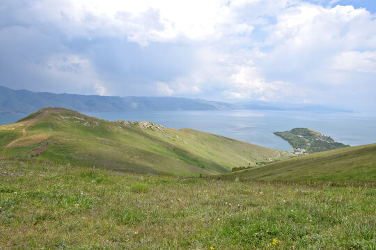 Breathtaking view of Lake Sevan from a hiking trail near the town of Sevan &ndash; a peaceful blend of water, sky, and surrounding mountains.