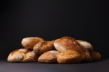 Freshly Baked Artisan Bread displayed on a dark background, highlighting its craftsmanship