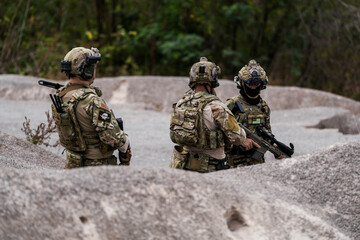 Special Forces Soldiers Armed and Ready During Tactical Training – Focused Military Men in...