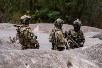 Special Forces Soldiers Armed and Ready During Tactical Training – Focused Military Men in...