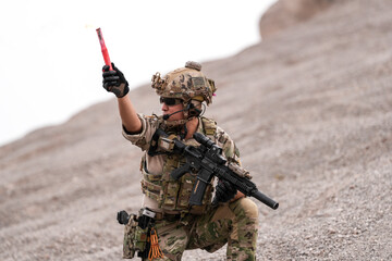 Special Forces Team During Military Operation on Rocky Slope – Soldier Holding Red Flare and...
