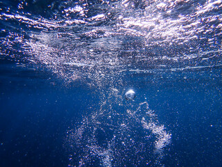 Air bubbles underwater rising to water surface, natural scene, bubbles under water, bubble...
