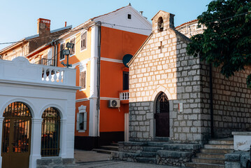 Old stone church in town of Omisalj, Krk island, Croatia