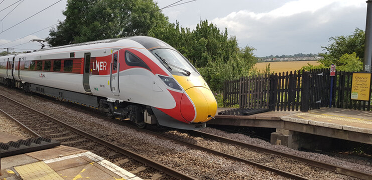 LNER Train running on tracks on a Network Rail operated track in the united kingdom