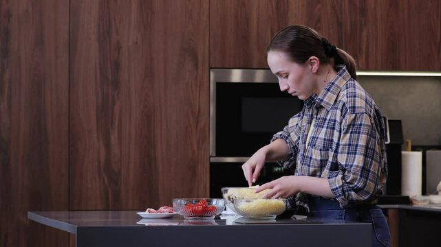 A skilled chef prepares a vibrant, delicious dish in a modern kitchen, showcasing impressive culinary artistry