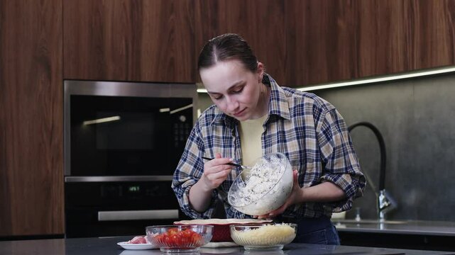 A skilled chef prepares a vibrant, delicious dish in a modern kitchen, showcasing impressive culinary artistry