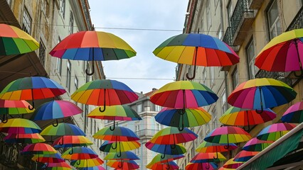 rainbow umbrellas on a lisbon street