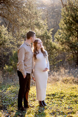 A Couple Joyfully Celebrating Their Pregnancy Announcement Surrounded by Beautiful Nature