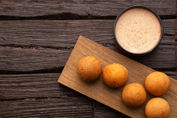 Fried buñuelos with hot chocolate - Traditional Colombian cuisine