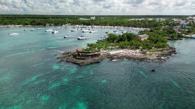 Stunning top-down view of Bayahibe bay in the Dominican Republic, showing panorama and boating activity below. Filmed 14 November 2024