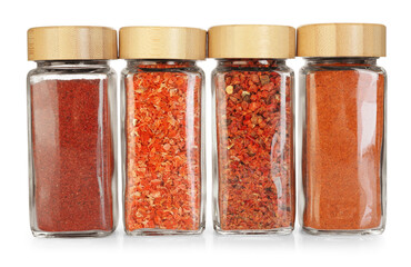 Many different aromatic spices in jars isolated on white