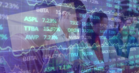 Colleagues in suits analyzing stock market data at office, with laptop monitors and ticker overlay