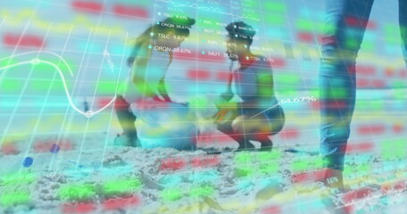 Digging child wearing swimsuit and adult watching in jeans on beach, with shovel, data overlay