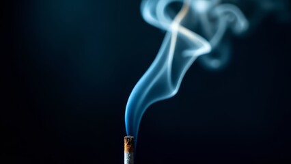 Incense smoke rising against dark backdrop