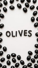 Black olives arranged in a circle with the word olives spelled out in the center on white