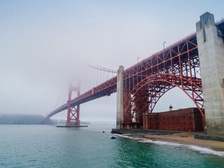 Golden Gate Bridge in San Francisco, USA, shrouded in fog. The iconic landmark connects the city, and Marin County.