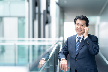 オフィスで働くビジネスマン　撮影強直：スカパー東京メディアセンター