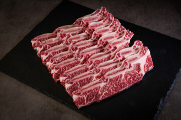Raw Short Ribs on a Black Slate