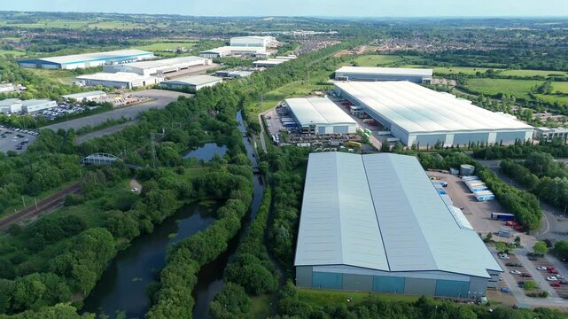 Aerial drone perspective of large warehouse data centres quantum computing and logistics hubs in Stoke on Trent England UK