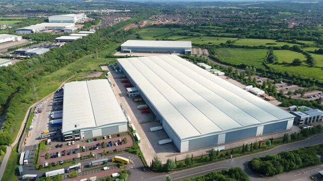 Aerial drone perspective of large warehouse data centres quantum computing and logistics hubs in Stoke on Trent England UK