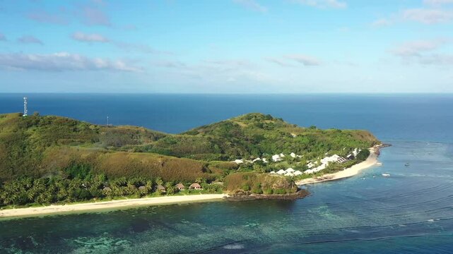 Remote Tokoriki island in Fiji on Pacific ocean coral reefs &ndash; aerial landscape as 4k.
