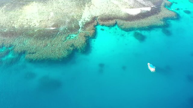 From Pacific ocean surface of Coral Reefs to Sky at Tokoriki island in Fiji &ndash; aerial 4k.
