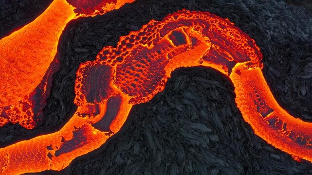Molten River: A Dynamic Aerial View of Flowing Lava on Volcanic Terrain, Texture