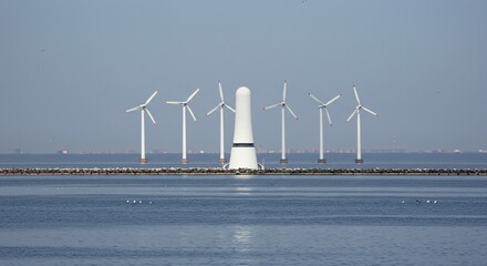 a group of wind turbines in the ocean
