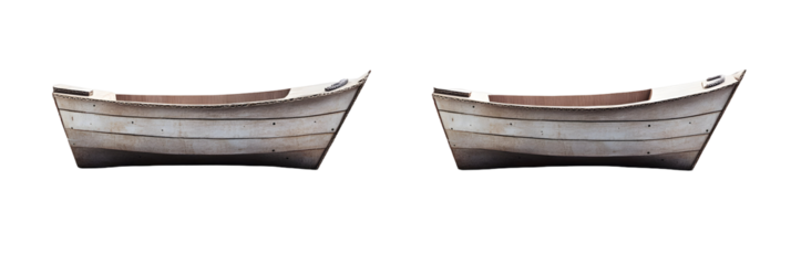 Two vintage wooden rowboats isolated against a stark black backdrop on the water surface