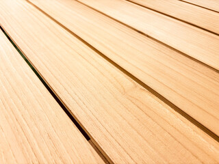 Smooth Wooden Planks Background with Natural Grain Texture. light-colored wooden planks arranged in...