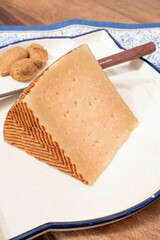 Very old anejo tostado Spanish hard cheese, cow and sheep curado, manchego, goat cheese close up