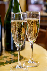 Pouring and tasting of dry sparkling wine brut, grand reserve, champagne in Ay-Champagne wine making village in Vallee de la Marne, , Champagne region, France