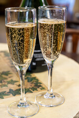 Pouring and tasting of dry sparkling wine brut, grand reserve, champagne in Ay-Champagne wine making village in Vallee de la Marne, , Champagne region, France