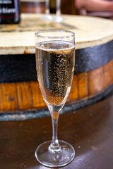 Pouring and tasting of dry sparkling wine brut, grand reserve, champagne in Ay-Champagne wine making village in Vallee de la Marne, , Champagne region, France