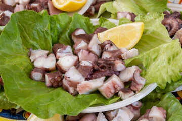 Catch of the day, fresh tasty seafood, grilled octopus sicilian style on fish marken in Palermo,...