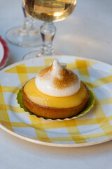 One piece of lemon tart with white eggs meringue from French pastry shop