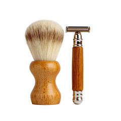 Elegant grooming tools: a classic shaving brush with a light-colored brush and a safety razor with a wooden handle.