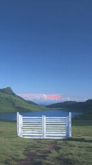 Tranquil mountain lake vista with white gate