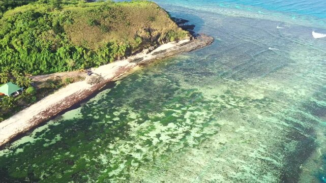 Shallow coral reefs waters at beach on Tokoriki island in Fiji &ndash; pacific ocean resort 4k.
