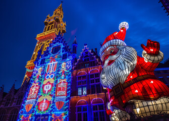  Illuminated and colorful christmas figure on Christmas market with blue sky