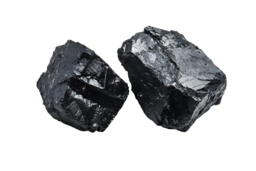 Two pieces of natural coal isolated on a black background, fuel industry