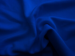 Wrinkled fabric texture. Blue wavy cloth background