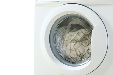 Towels neatly arranged in washing machine, isolated on white, PNG